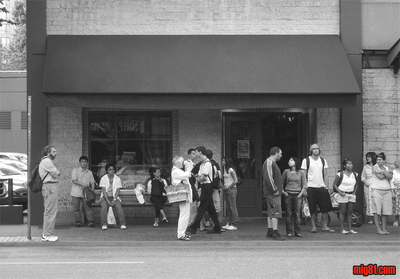 people waiting at the bus/stop